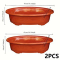 2 large oval plastic flower pots for indoor plant cultivation. Decorative flower pots for indoor plants.